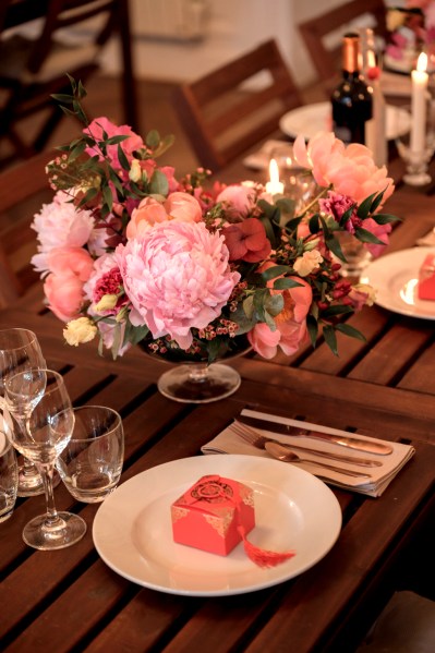 Up close detail of roses pink flowers cutlery on table